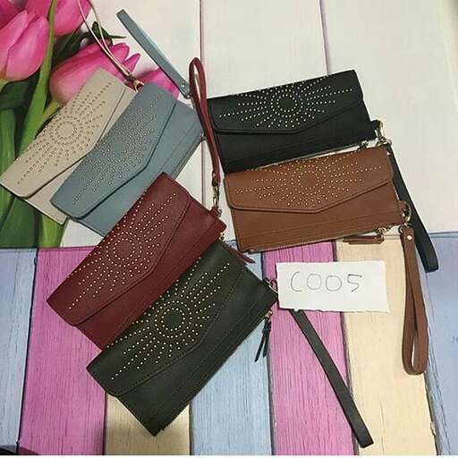 a bunch of purses that are on a table.
