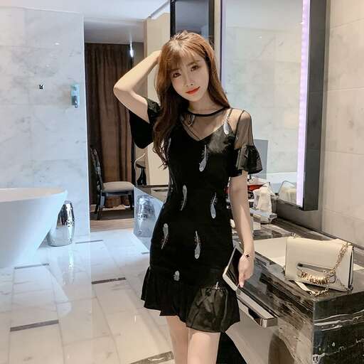 a model in a black dress and a black dress