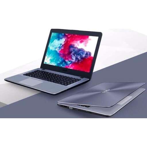 a laptop computer sitting on top of a table.