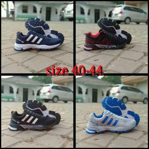 a pair of shoes that are on a sidewalk.