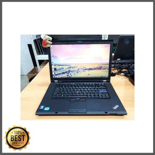 a black laptop computer with a picture of a car on the screen.