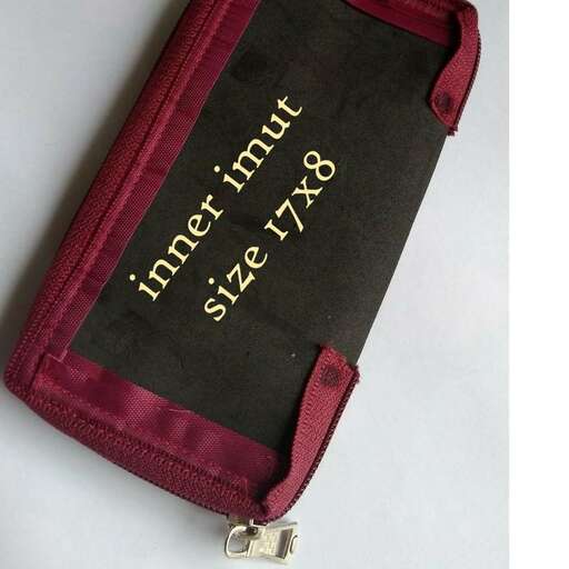 a small pouch with a large number of items in it.