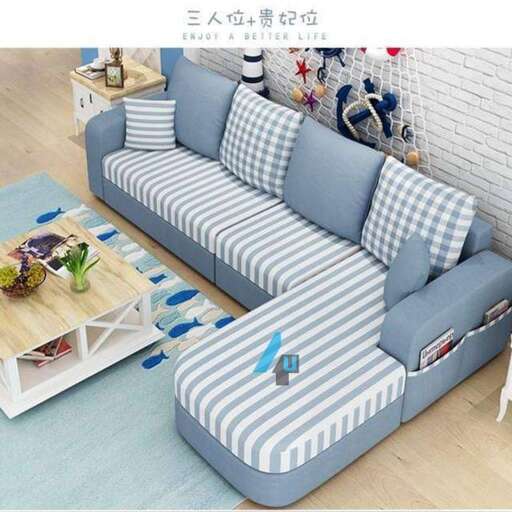a blue and white striped sofa with a side table.