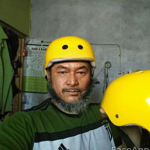 a man wearing a yellow helmet and a yellow helmet.