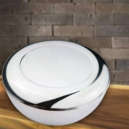 a white cowboy hat on a wooden table.