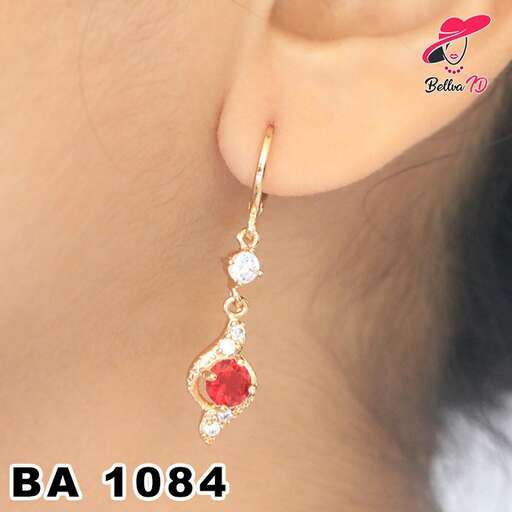 red and white gold earrings with a pearl and diamonds in the center.