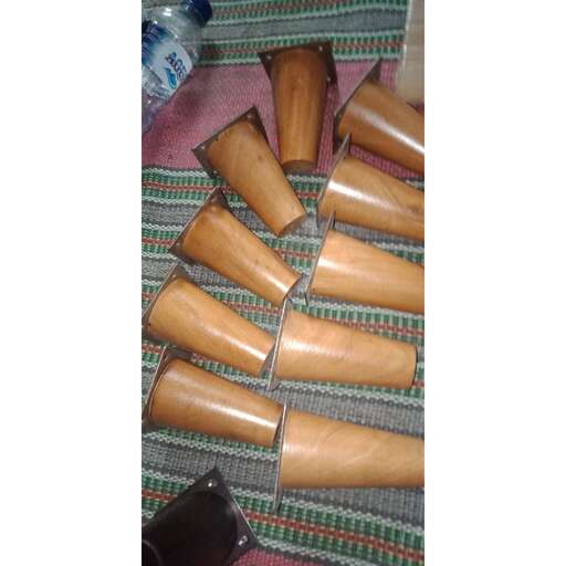 a pile of wooden tubes