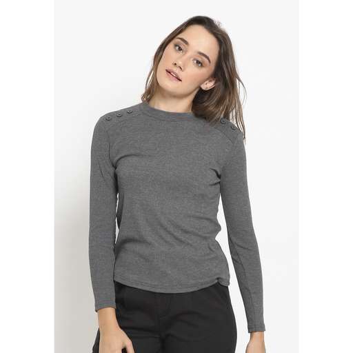 a long sleeved tee is worn with a long sleeved shirt.