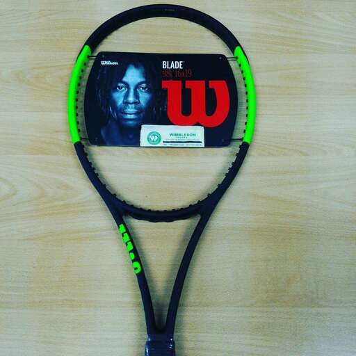 a tennis racket with a picture of a man on it.