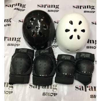 a helmet and helmet are sitting on a table.