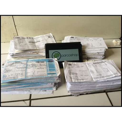 a pile of papers sitting on top of a table.