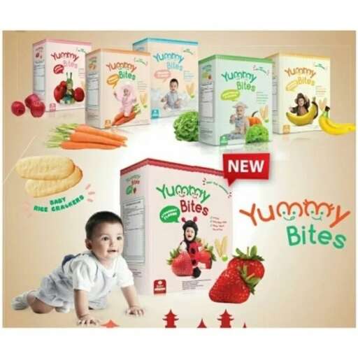 a baby is looking at a box of cereal.