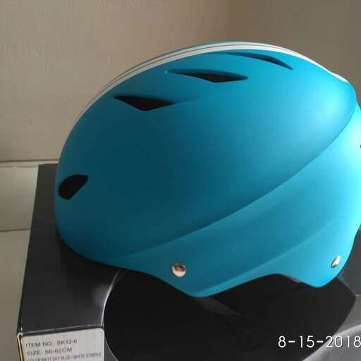 a blue helmet with a black design on it.