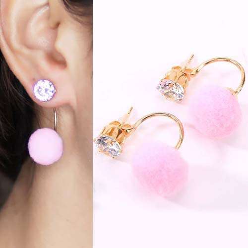 pink and white earrings with a diamond