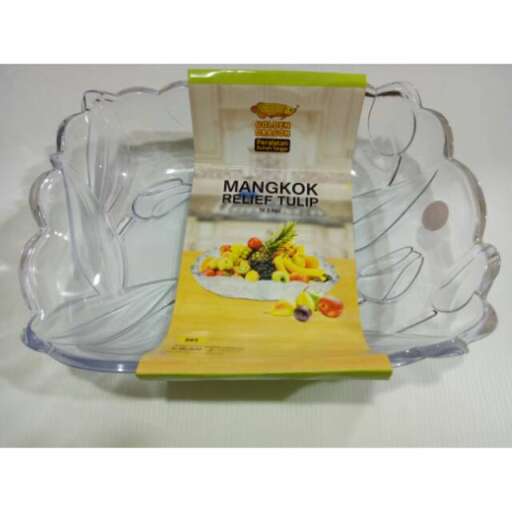 a glass bowl with a serving dish of fruit and vegetables.
