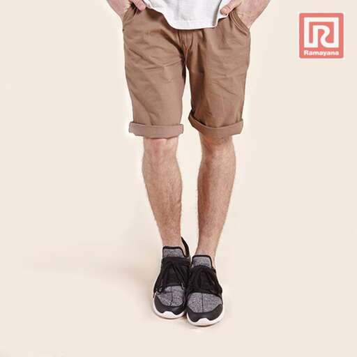 a man standing with his hands in his pockets.