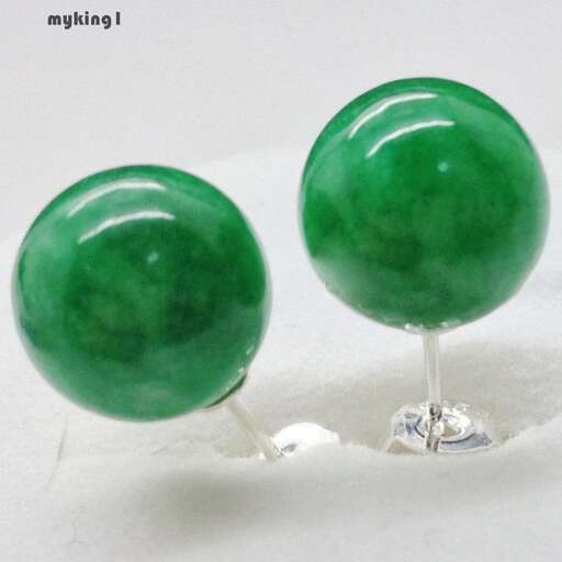 green glass beads in a drop of water