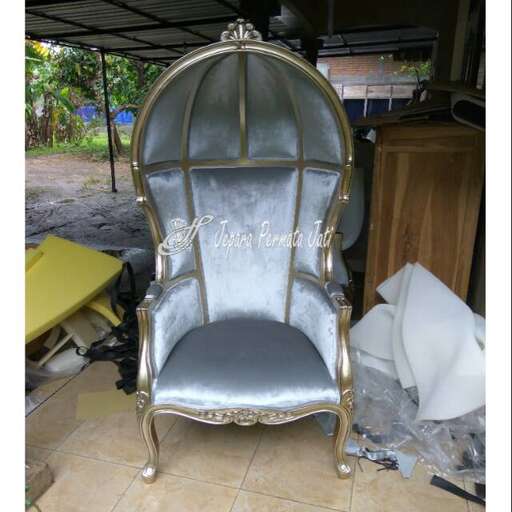 a chair that is sitting on a tile floor.