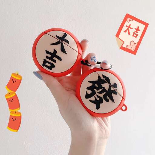 a hand holding a pair of red and white signs.