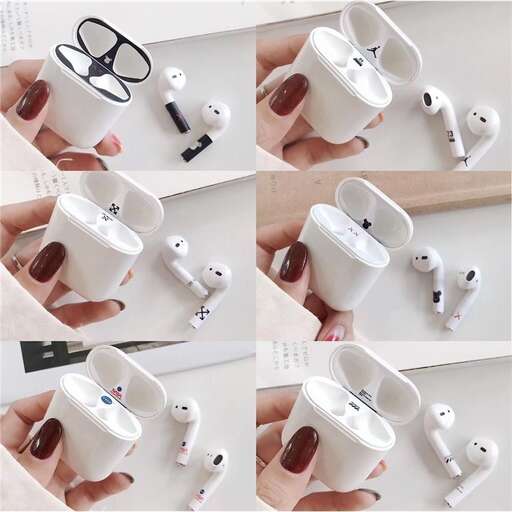 a person holding a white controller with a pair of glasses.