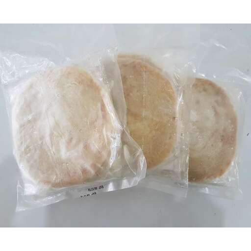 three buns in a plastic bag with a label on the inside.