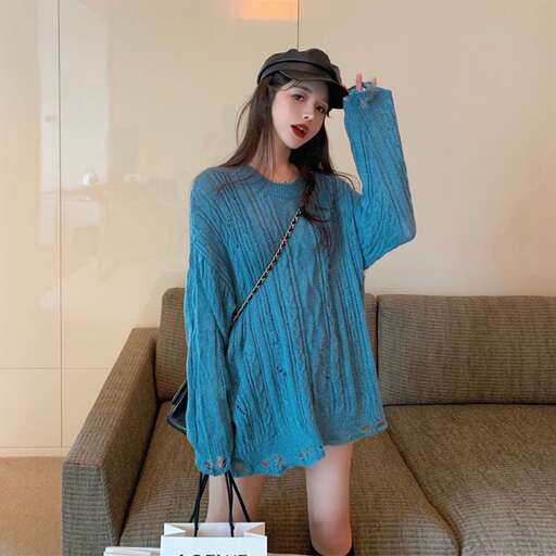 a girl in a blue dress and hat