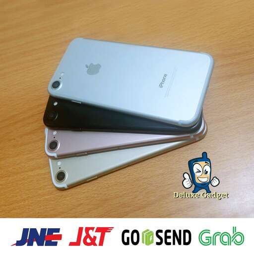 a silver iphone with a black case on top of it.