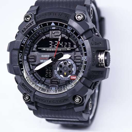 the watch is made of black leather.