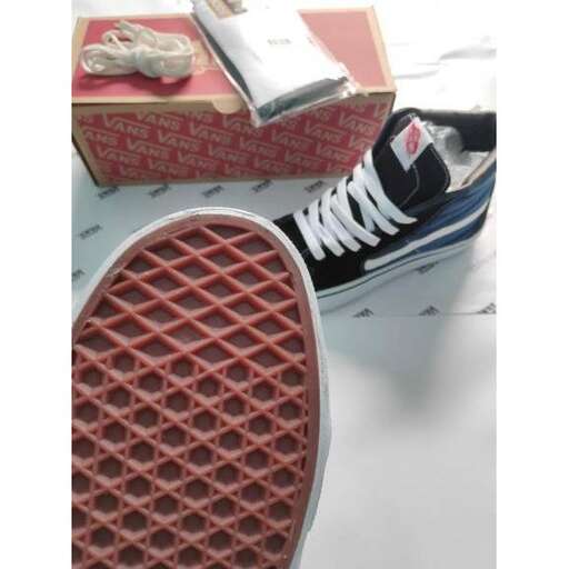 a pair of sneakers sitting on top of a table.