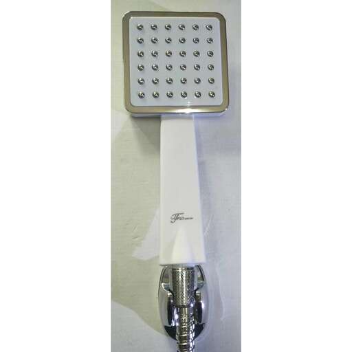 a close up of a light fixture with a white paper towel dispenser.