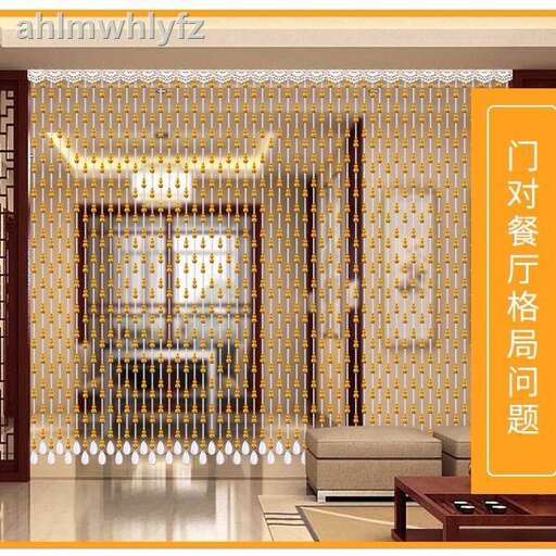 a modern house in the center of the city. the walls are decorated with gold and white tiles.