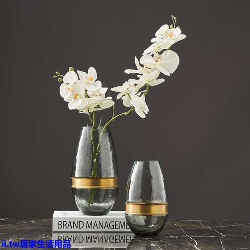 a vase with flowers in it sitting on a table.