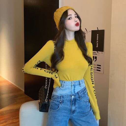 person in a yellow top and jeans