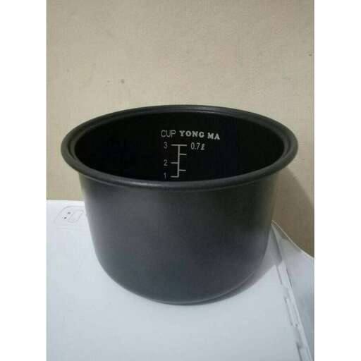 a black bowl with a measuring cup inside.