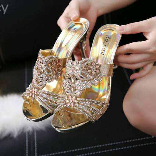 the bride's shoes are made from a pair of gold sandals.