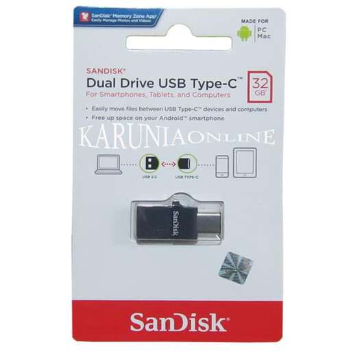 a silver and black computer mouse box with a usb cable.