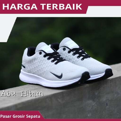 a pair of white and black running shoes