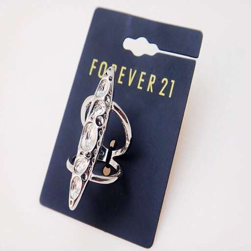 a sterling silver pocket watch with a gold chain and a key.