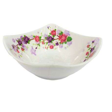 a large white bowl with flowers painted on the inside.