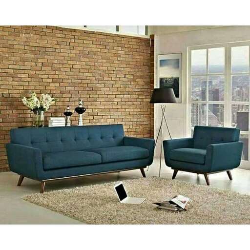 a modern living room with a modern sofa and a lamp.