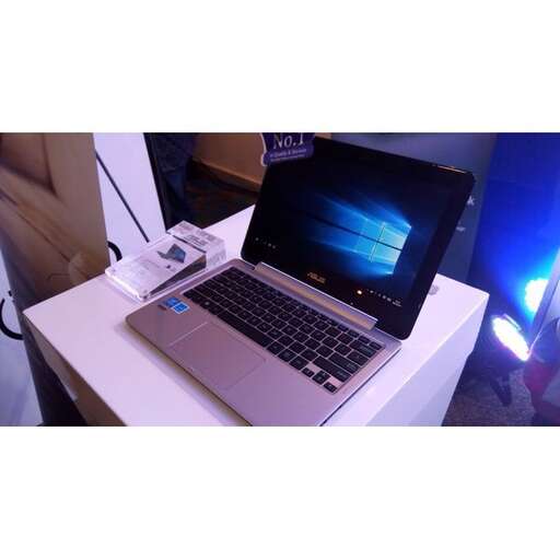 a laptop computer sitting on top of a white table.