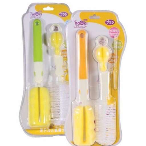 a pair of plastic toothbrushes with a yellow handle.