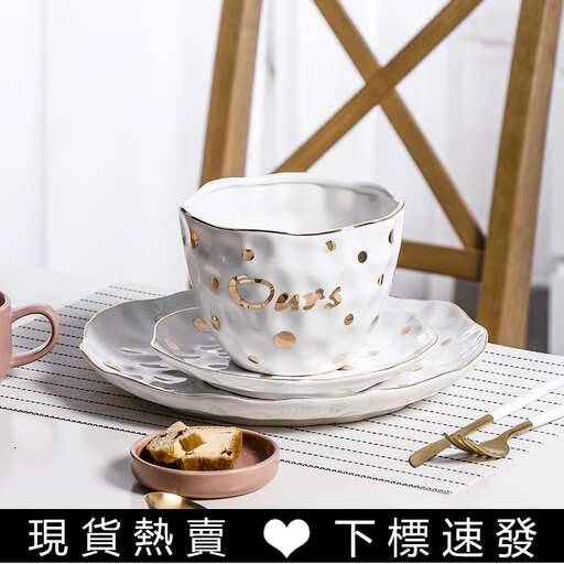 a tea cup and saucer on a table