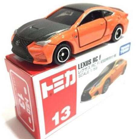 a toy car on a box with a sign
