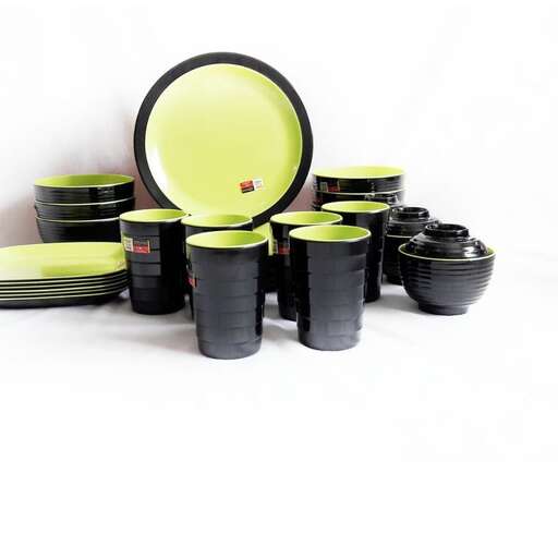 a set of black and green bowls and cups.