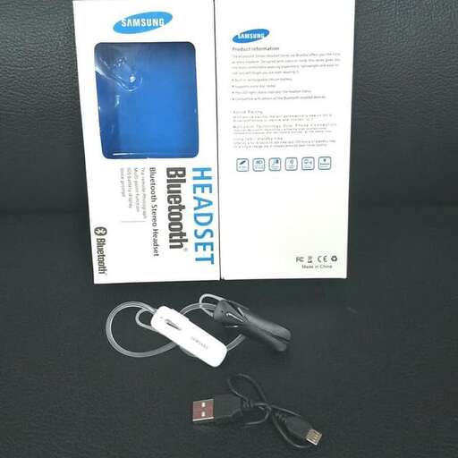 a pair of scissors and a package of paper on a table.