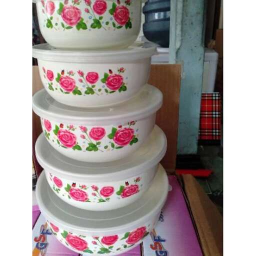 a stack of colorful plates on a table.