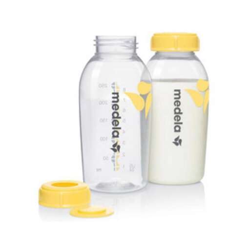 a bottle of milk with a yellow lid and cap.