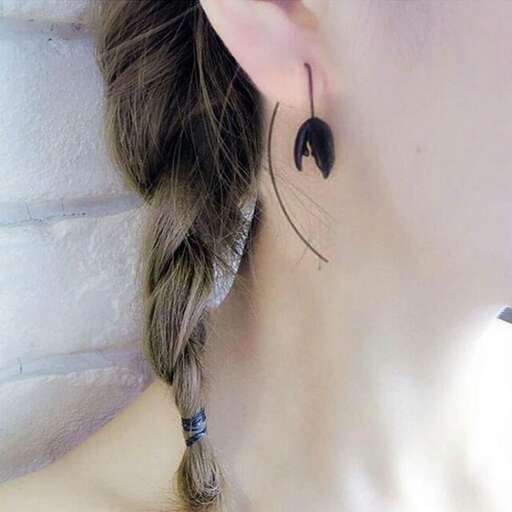 earrings with a wire wrapped around the ear
