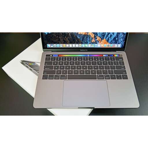 a laptop computer sitting on top of a desk.